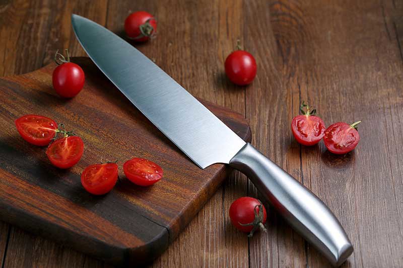 kitchen knife and tomatoes